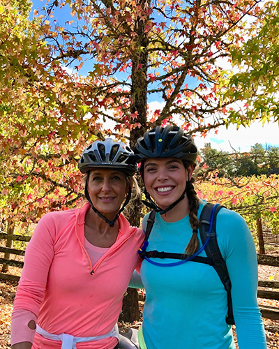 Two women smiling on a bike ride in Sonoma