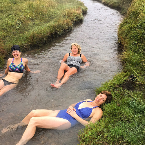Women lounging in the hot rivers in Iceland