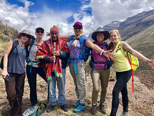 A women's retreat group in Peru posing with their guide