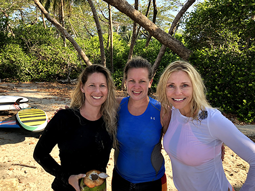Three Women's Quest participants after a surf session in Costa Rica