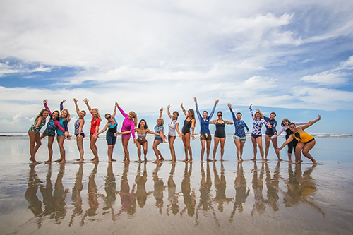 Women's Quest posing on the beach in Costa Rica