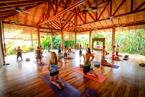 yoga during our women's surf camp Costa Rica