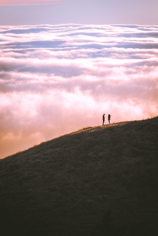 Image of two people on a mountain