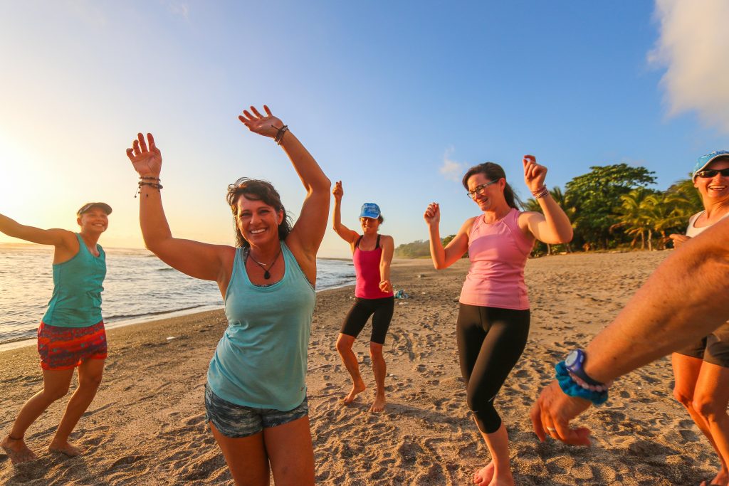 Women dancing on the beach in Hawaii