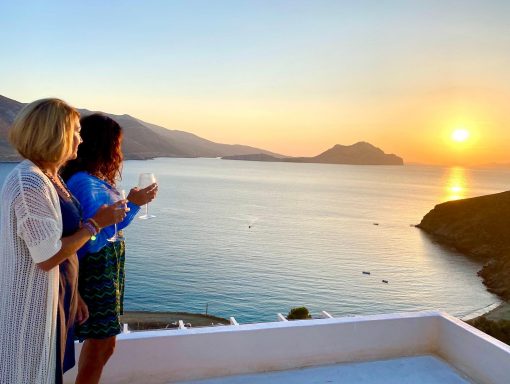 Two women viewing sunset in Amorgos Greece
