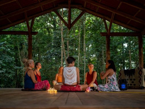 Group of women meditating on women's adventure retreat in the Canyon lands