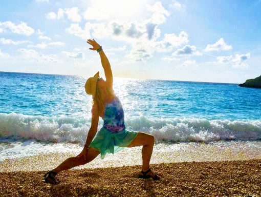 woman doing yoga on a beach in Croatia
