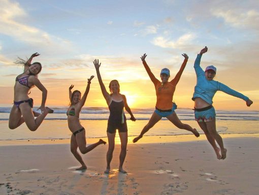 five women exploring a beach in Mexico