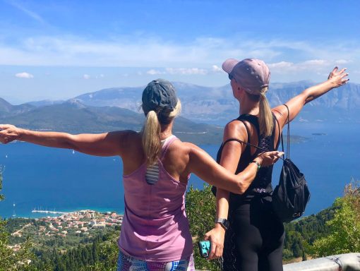 2 women in Greece standing in front of a great view